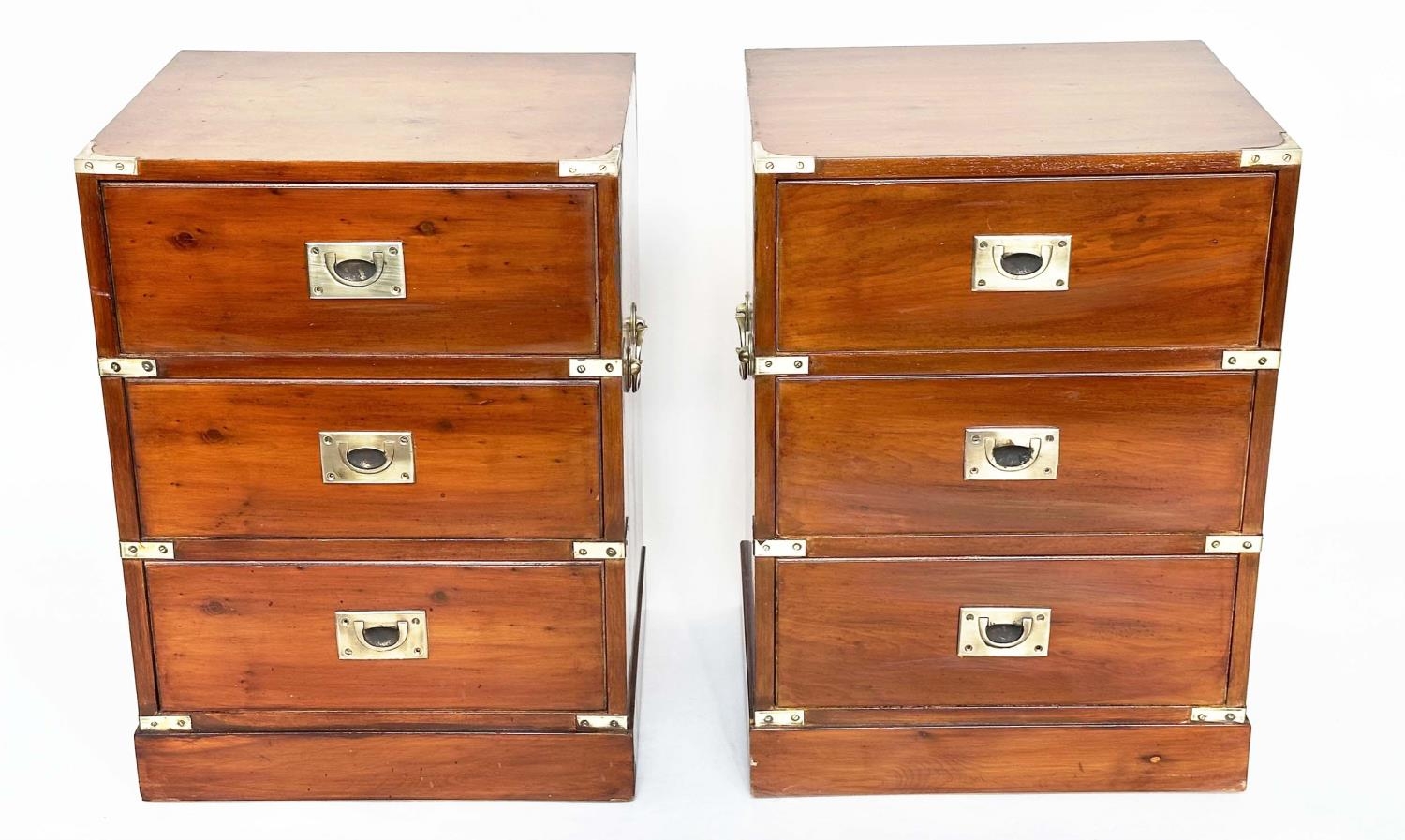 CAMPAIGN STYLE CHESTS, a pair, yewwood and brass bound each with three drawers, 46cm x 38cm x 63cm