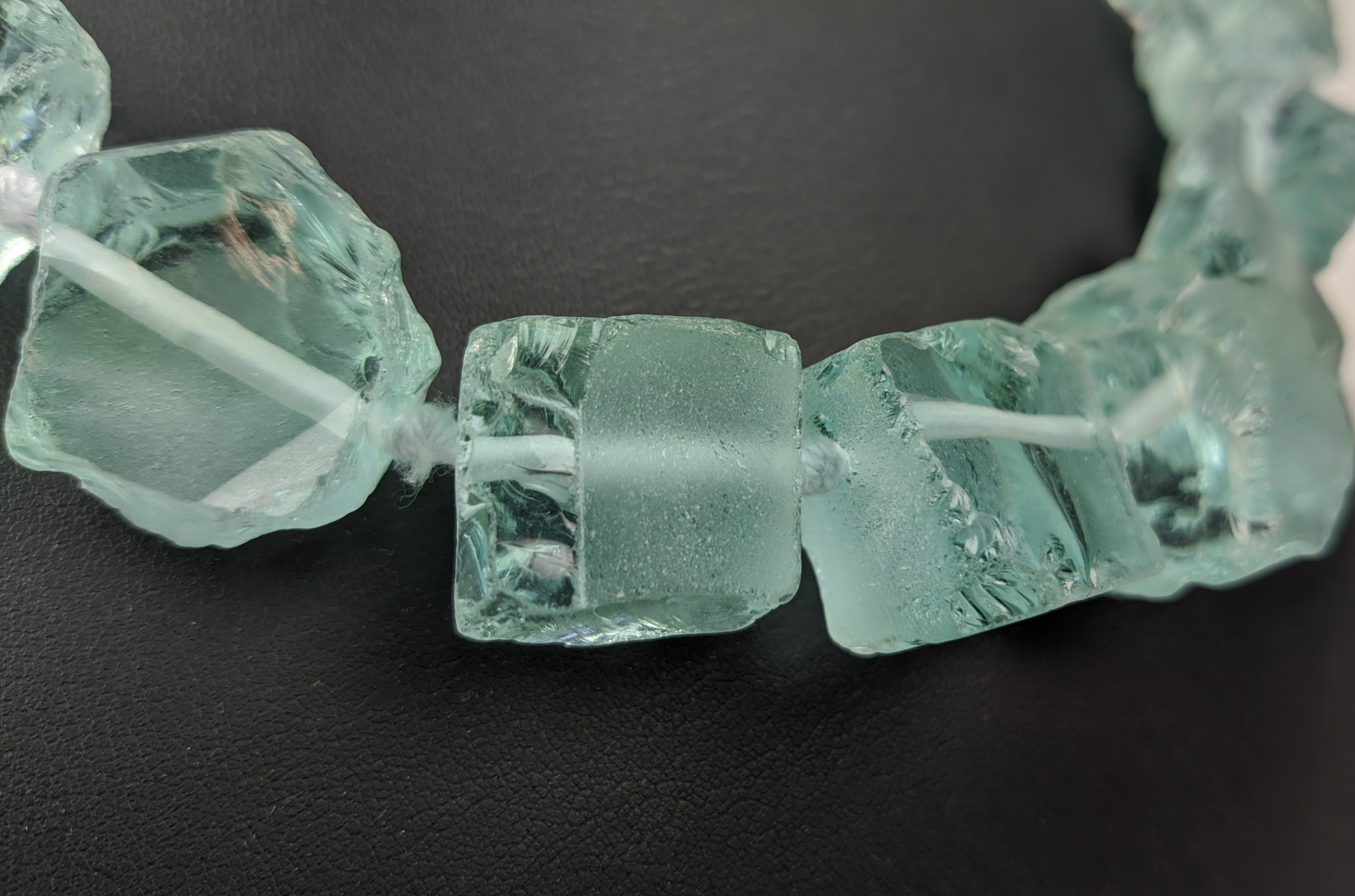 AN AQUAMARINE COLOURED ROUGH STONE NECKLACE, with a paste diamond clasp, 46cm long, together with - Image 3 of 10