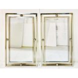 ARCHITECTURAL WALL MIRRORS, a pair, Art Deco style, polished metal frames, 100cm H x 60cm W. (2)