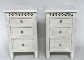 BEDSIDE CHESTS, a pair, French style grey painted each with three drawers and pierced frieze, 40cm x