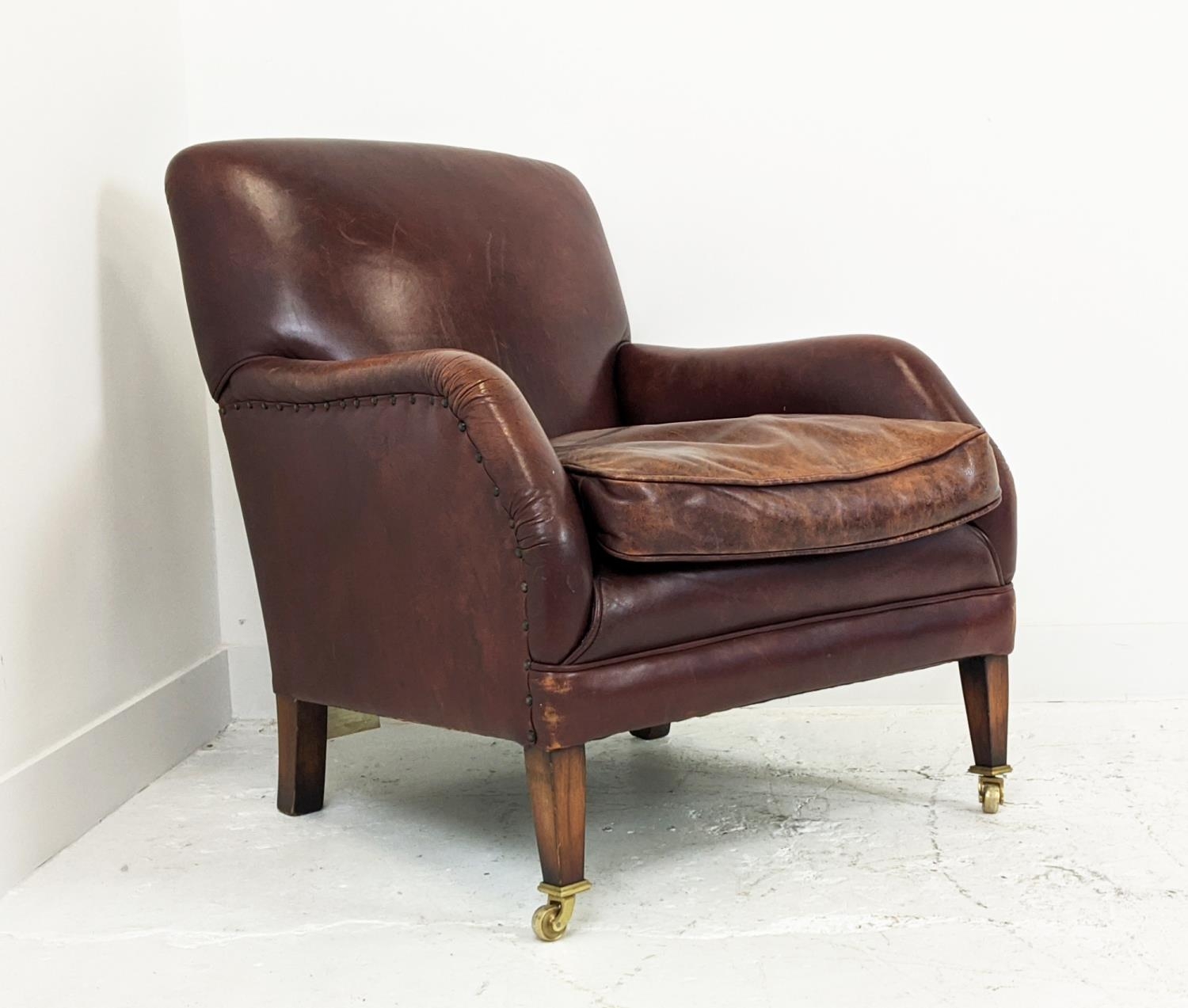 LIBRARY ARMCHAIR, studded tan leather raised on brass castors, 84cm H x 68cm W. - Image 3 of 9