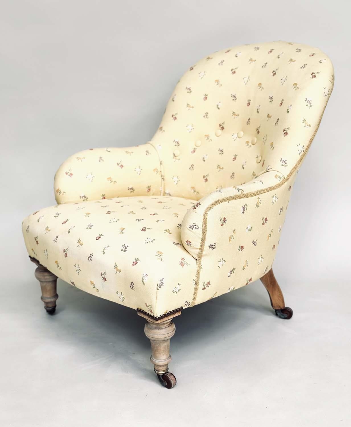 ARMCHAIR, 19th century primrose yellow and floral sprays with buttoned back and turned supports,