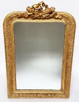 WALL MIRROR, 19th century French giltwood and gesso mounted arched with flambeau and quiver crest,