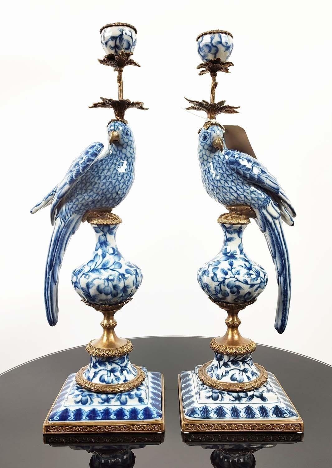 CANDLESTICKS, a pair, ceramic parrots with gilt mounts, 47cm H. (2)