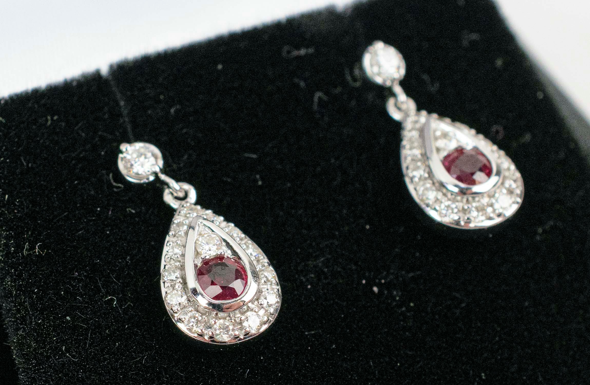 A PAIR OF 18CT WHITE GOLD RUBY AND DIAMOND PENDANT EARRINGS, each of tear-drop form, butterfly