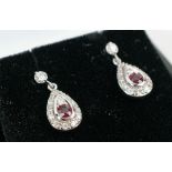 A PAIR OF 18CT WHITE GOLD RUBY AND DIAMOND PENDANT EARRINGS, each of tear-drop form, butterfly