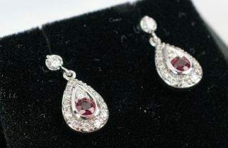 A PAIR OF 18CT WHITE GOLD RUBY AND DIAMOND PENDANT EARRINGS, each of tear-drop form, butterfly