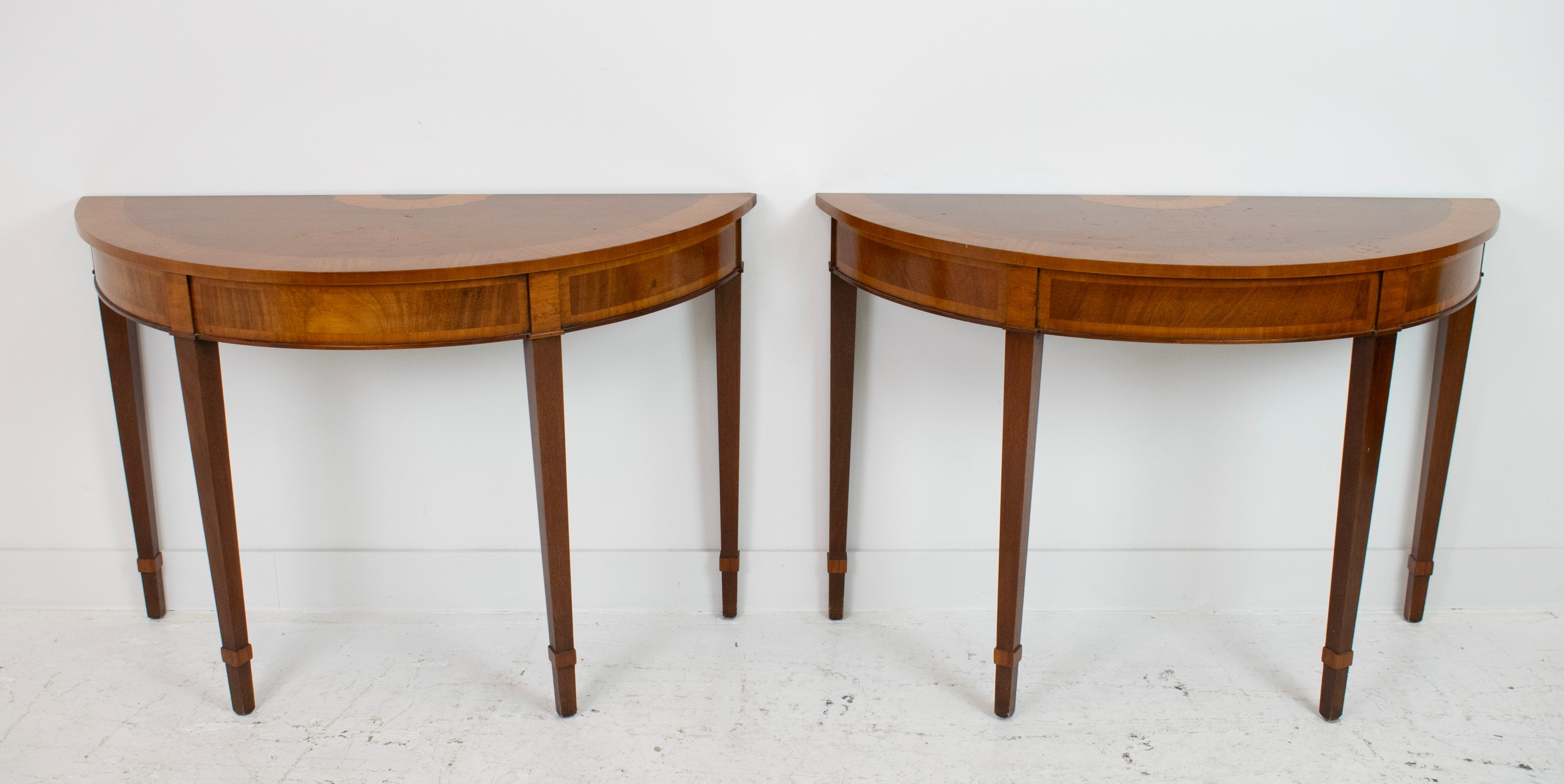 DEMI LUNE TABLES, a pair, George III design mahogany and satinwood inlaid, 77cm H x 112cm x 47cm. (