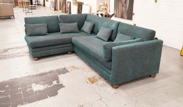 CORNER SOFA, turquoise upholstery, raised on bun supports, 225cm W x 180cm D x 85cm H.