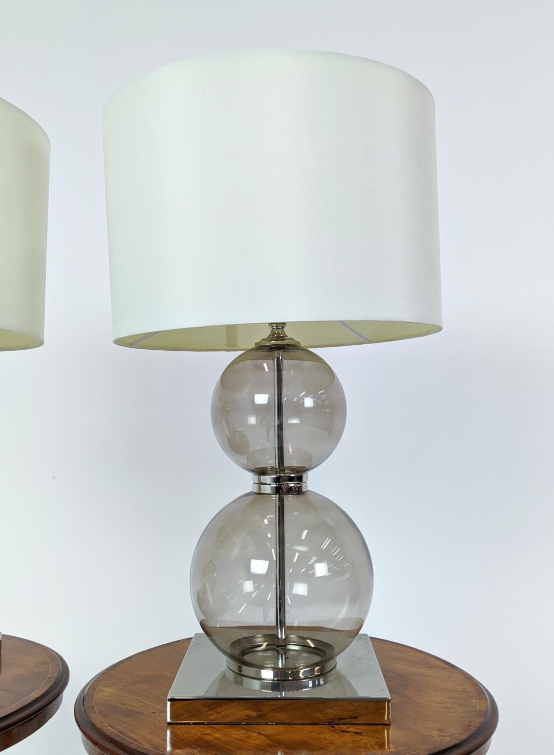 TABLE LAMPS, a pair, glass ball stems on square polished metal bases, 61cm H x 35cm W in shades. (2) - Image 4 of 6
