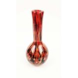 A MURANO STYLE GLASS VASE, of bottle form, red ground with black and gold coloured streaks, 31cm