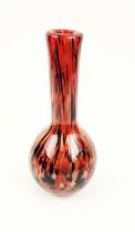 A MURANO STYLE GLASS VASE, of bottle form, red ground with black and gold coloured streaks, 31cm