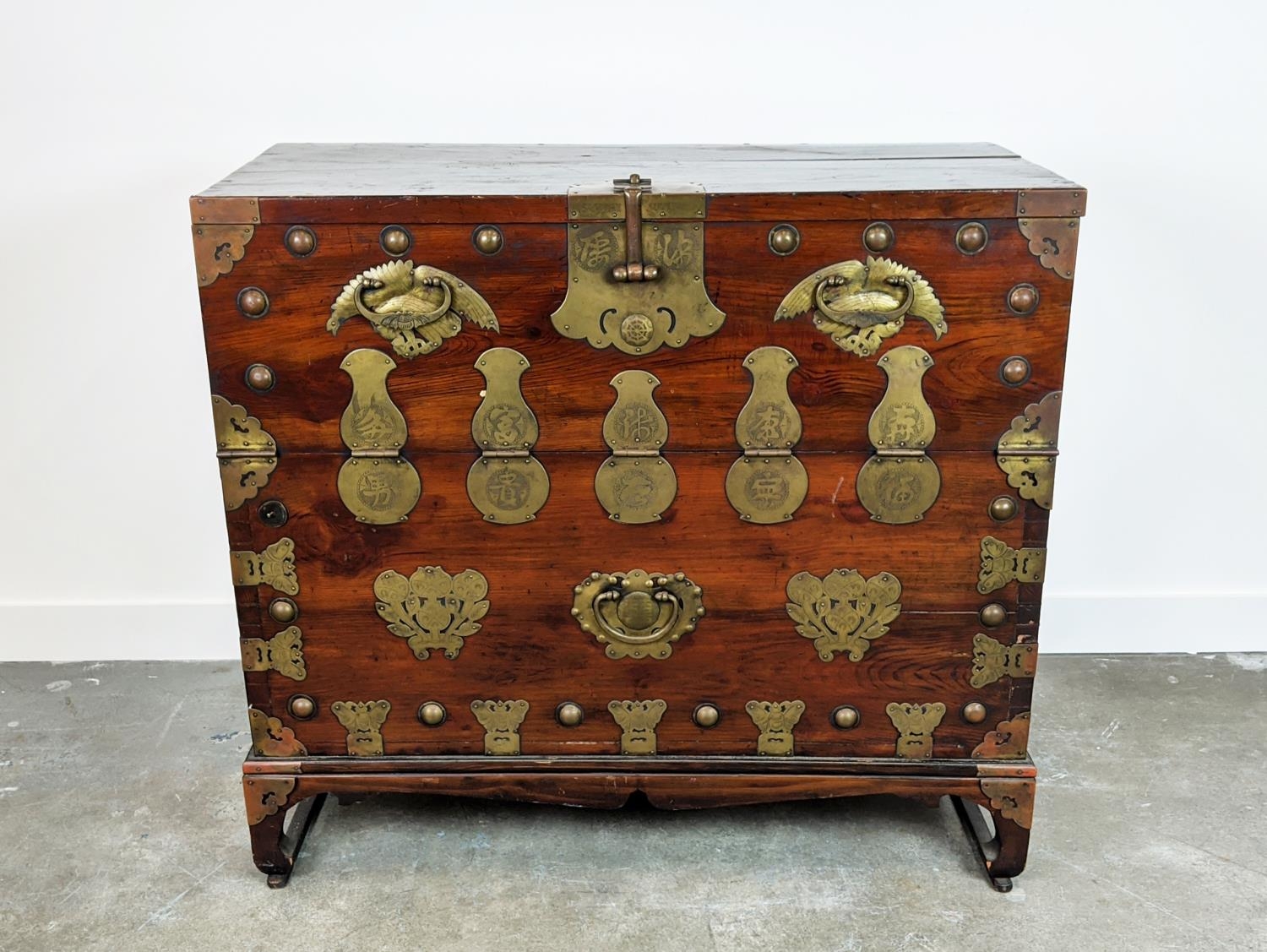 CHEST, 19th century Korean firwood and brass mounted with fall front enclosing four drawers, 99cm