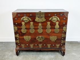 CHEST, 19th century Korean firwood and brass mounted with fall front enclosing four drawers, 99cm