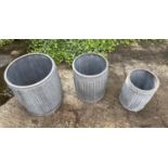 PLANTERS, a graduated set of three, in ribbed zinc, largest 50cm H x 45cm x 45cm. (3)