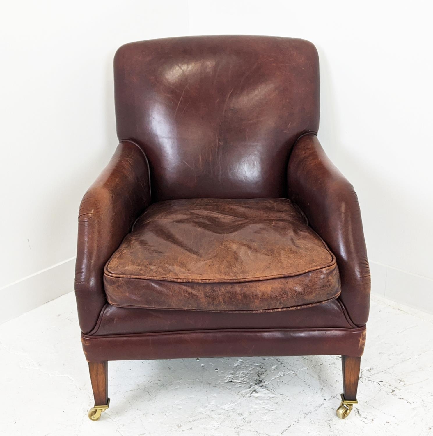 LIBRARY ARMCHAIR, studded tan leather raised on brass castors, 84cm H x 68cm W. - Image 4 of 9