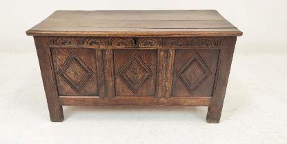 COFFER, 17th century oak, with a carved triple panelled front and rising lid revealing a candle box,