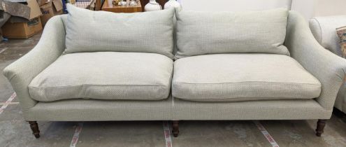 SOFA, three seater, light green upholstery on turned wood supports, 250cm L x 81cm H x 100cm D.
