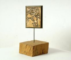 AFTER JOAN MIRO, bronze plaque, mounted onto wooden plinth, personnages, xxe siecle number 4,
