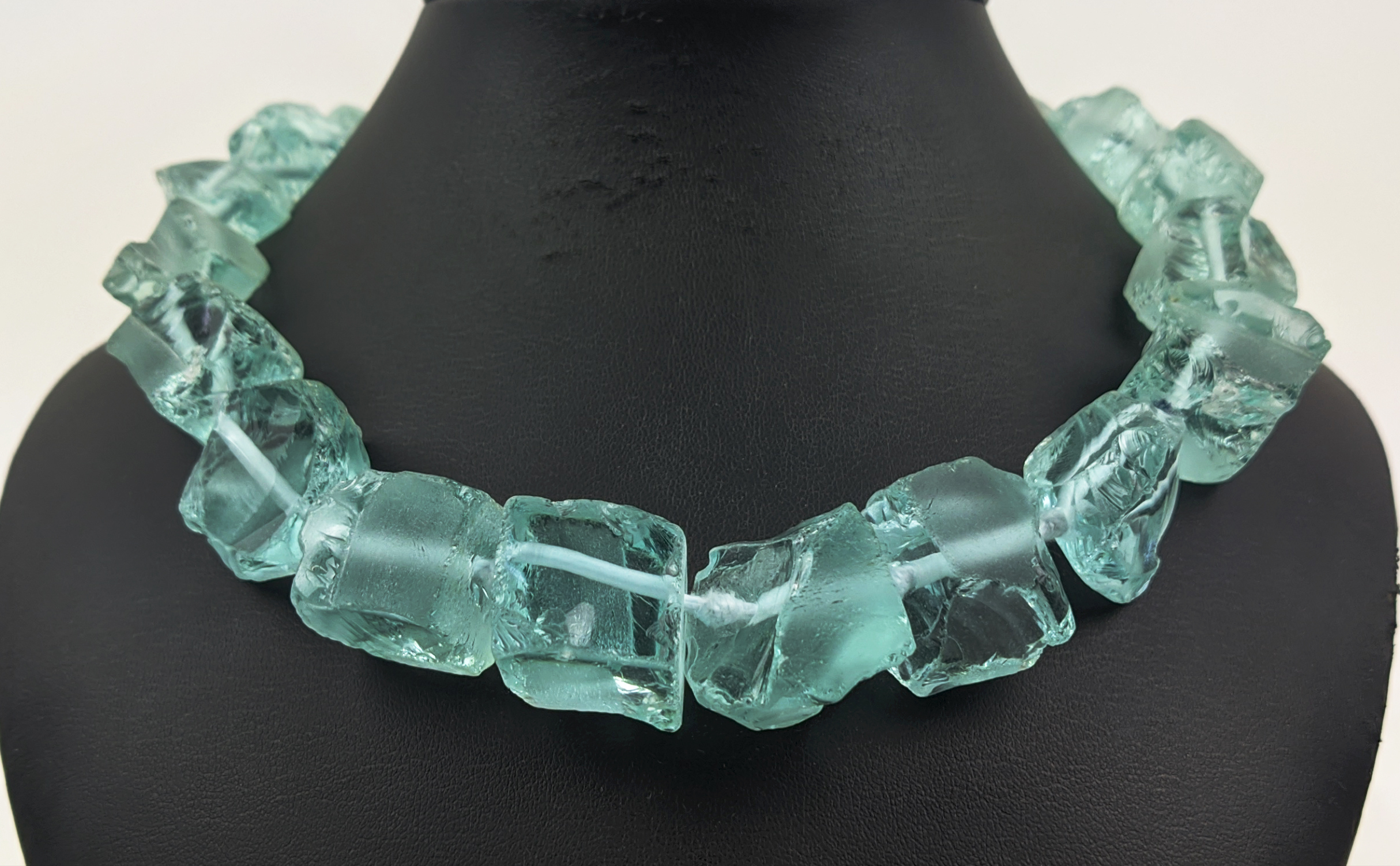 AN AQUAMARINE COLOURED ROUGH STONE NECKLACE, with a paste diamond clasp, 46cm long, together with - Image 2 of 10