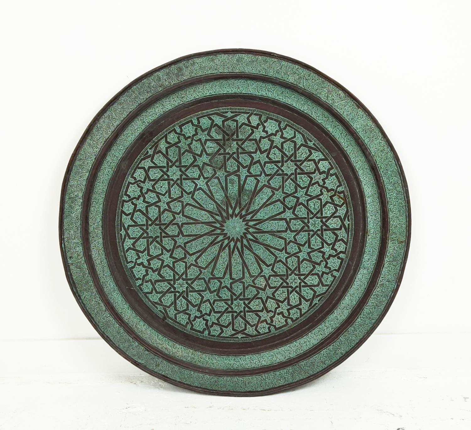 NEAR EASTERN COPPER CHARGER, incised Islamic decoration, 96cm diam.