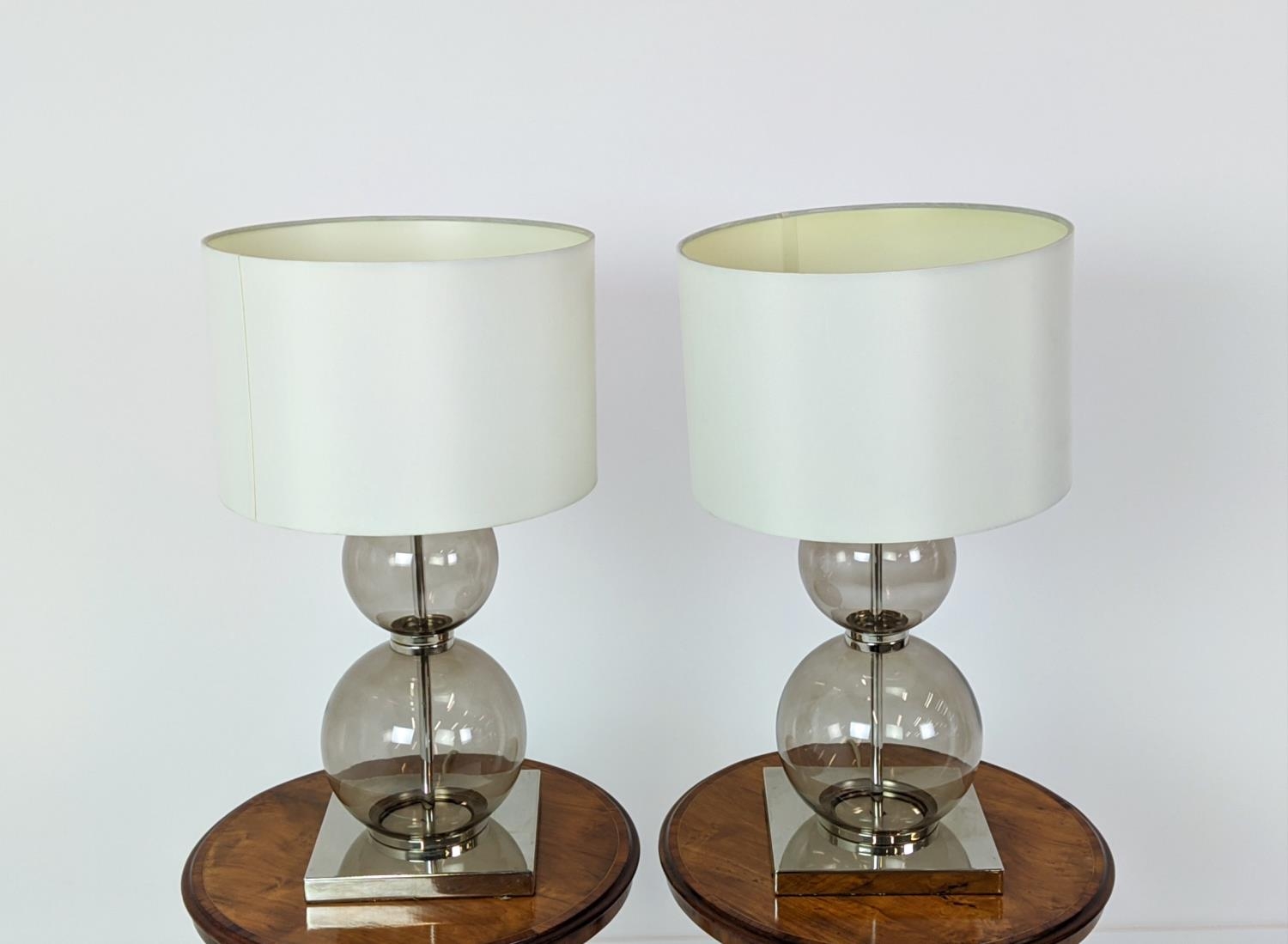 TABLE LAMPS, a pair, glass ball stems on square polished metal bases, 61cm H x 35cm W in shades. (2) - Image 2 of 6