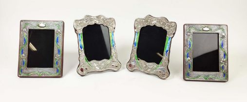 PHOTO FRAMES, a pair, silvered metal and enamel, 21cm H x 16cm, together with a similar pair, 19cm H