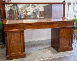 PEDESTAL SIDEBOARD, Victorian mahogany with mirrored back above three frieze drawers and two doors