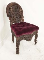 BURMESE SIDE CHAIR, 19th century rosewood with a heavily carved back, with ram's head, 58cm W x 94cm