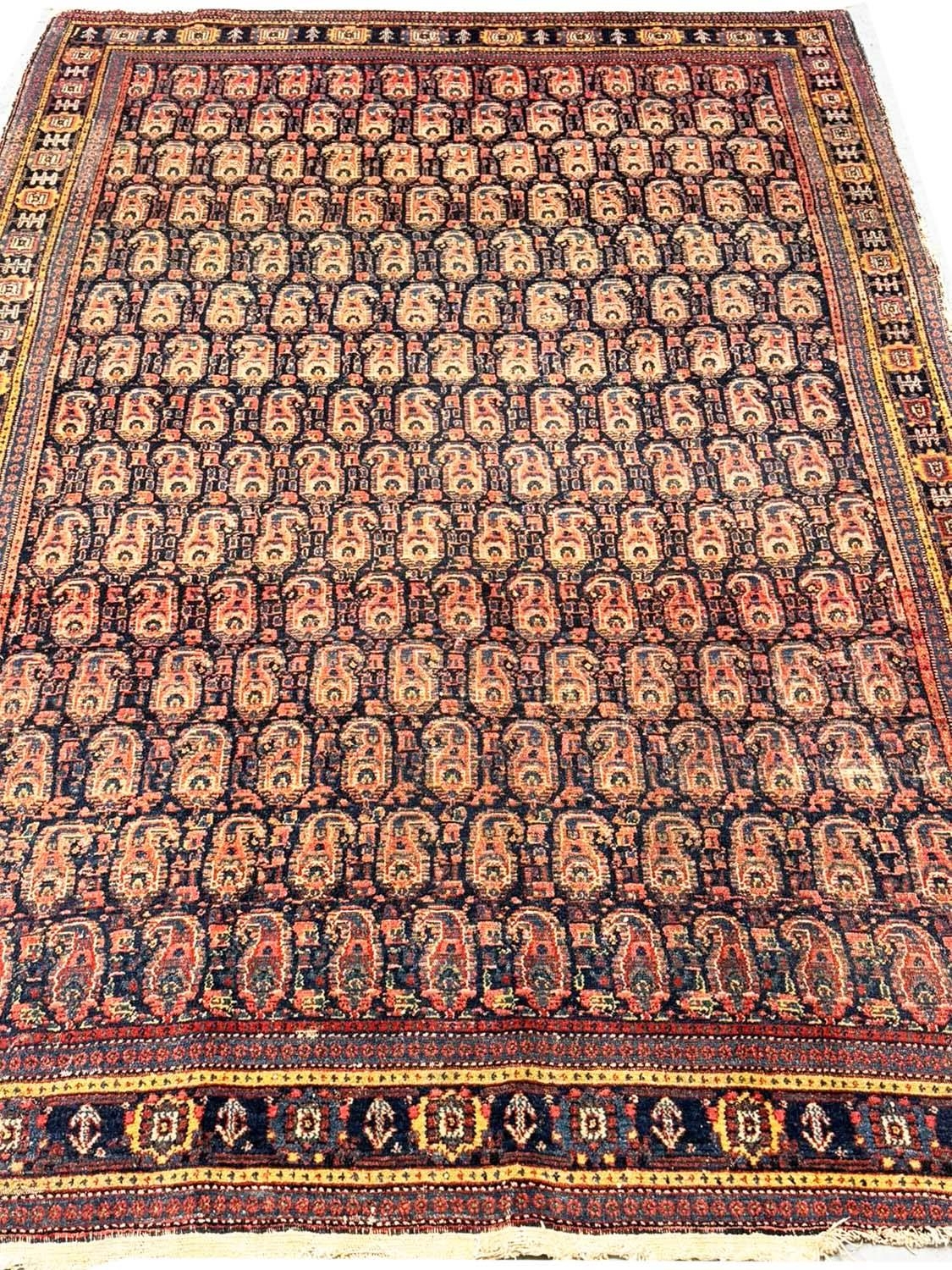 ANTIQUE PERSIAN PAISLEY DESIGN RUG, 210cm x 137cm.