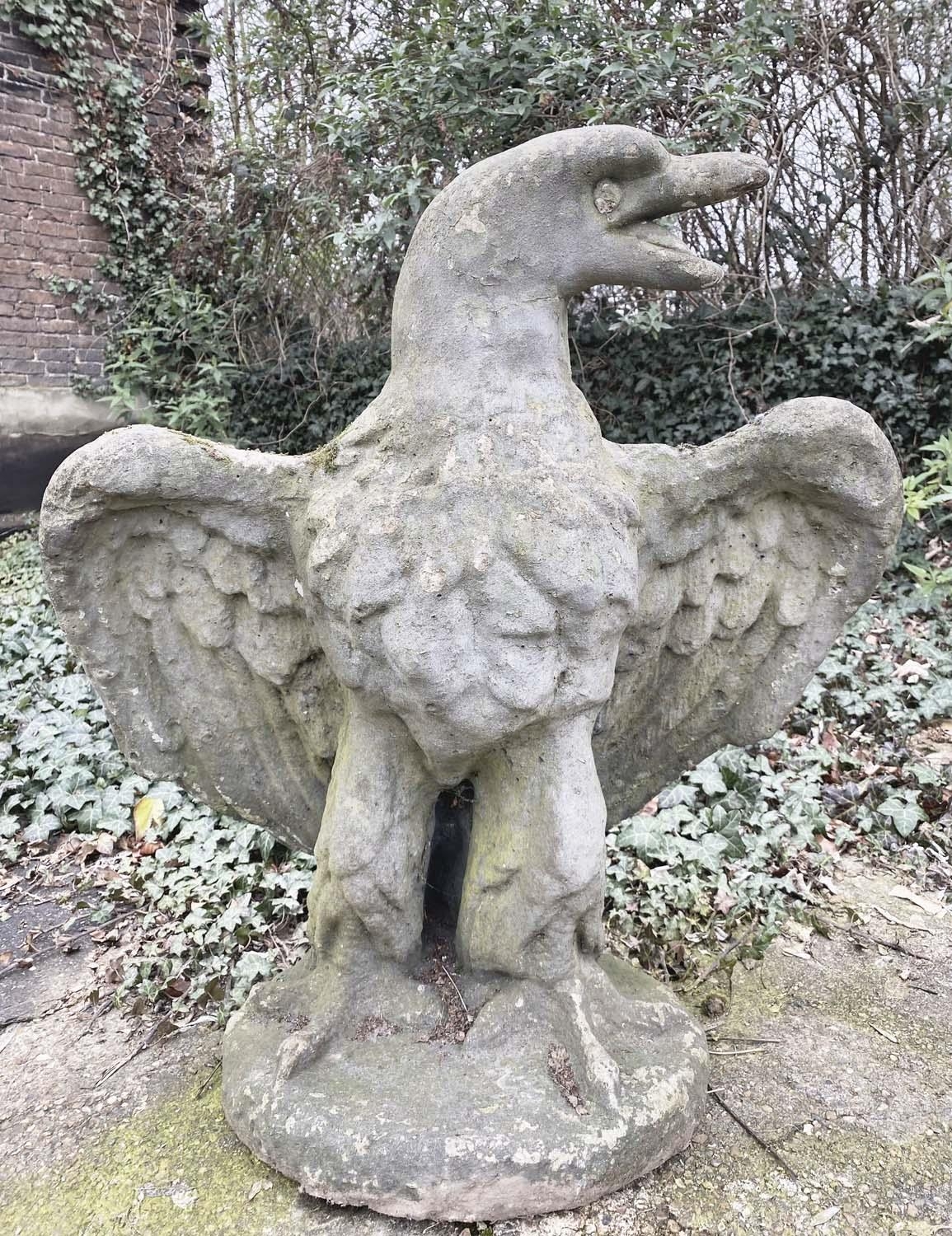 GARDEN STATUE OF AN EAGLE, reconstituted stone in a weathered finish, 81cm H x 75cm W x 46cm D.