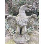 GARDEN STATUE OF AN EAGLE, reconstituted stone in a weathered finish, 81cm H x 75cm W x 46cm D.