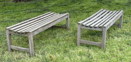 GARDEN BENCHES, a pair, well weathered teak and slatted, 140cm W x 50cm D x 44cm H. (2)
