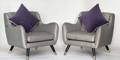 HOOPER ARMCHAIRS, a pair, 1960s style, with silver grey upholstery and outswept brass capped legs,