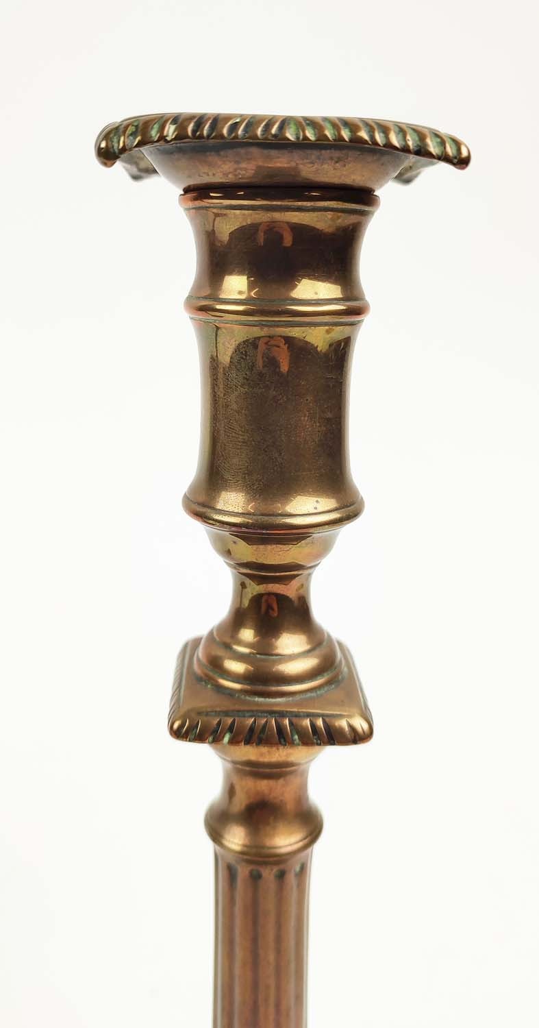 A PAIR OF GEORGE III BRASS CANDLESTICKS, in the Adamesque style, each 26cm H. - Image 5 of 6