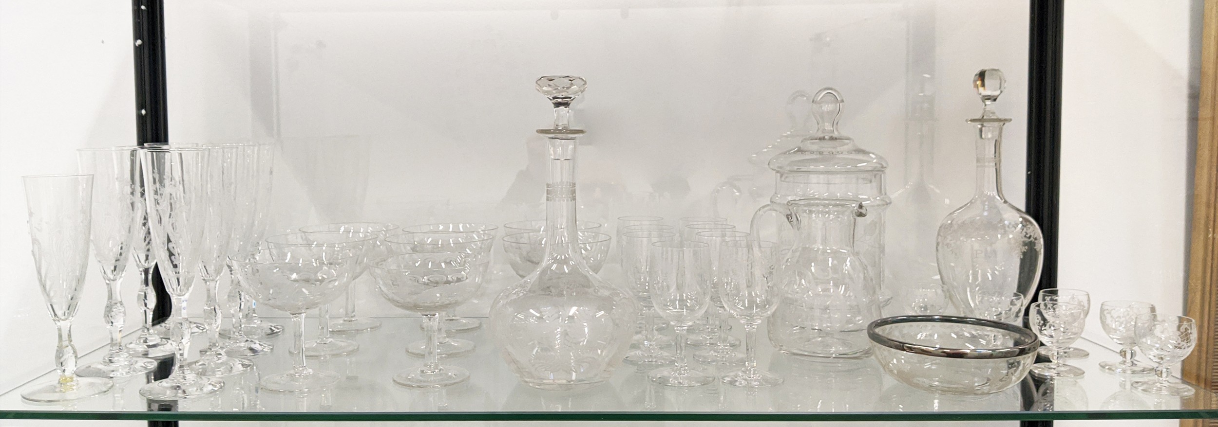 QUANTITY OF ENGRAVED GLASSWARE, including eight champagne flutes, decanter vodka glass set, eight