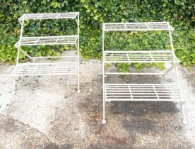 GARDEN ETAGERE PLANT STANDS, a pair, white metal with three tiers, 63cm H x 62cm x 60cm. (2)