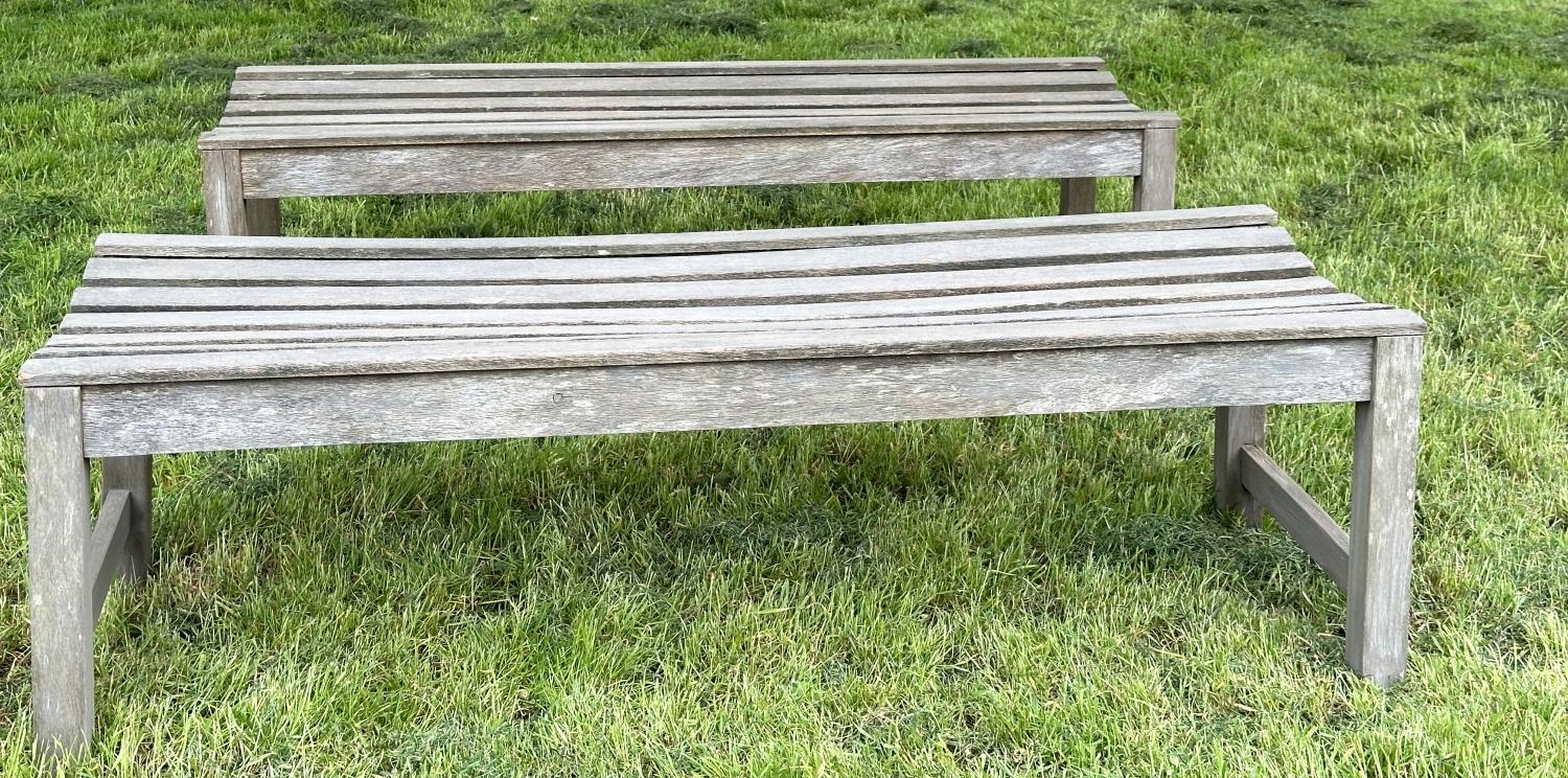 GARDEN BENCHES, a pair, well weathered teak and slatted, 140cm W x 50cm D x 44cm H. (2) - Image 6 of 6