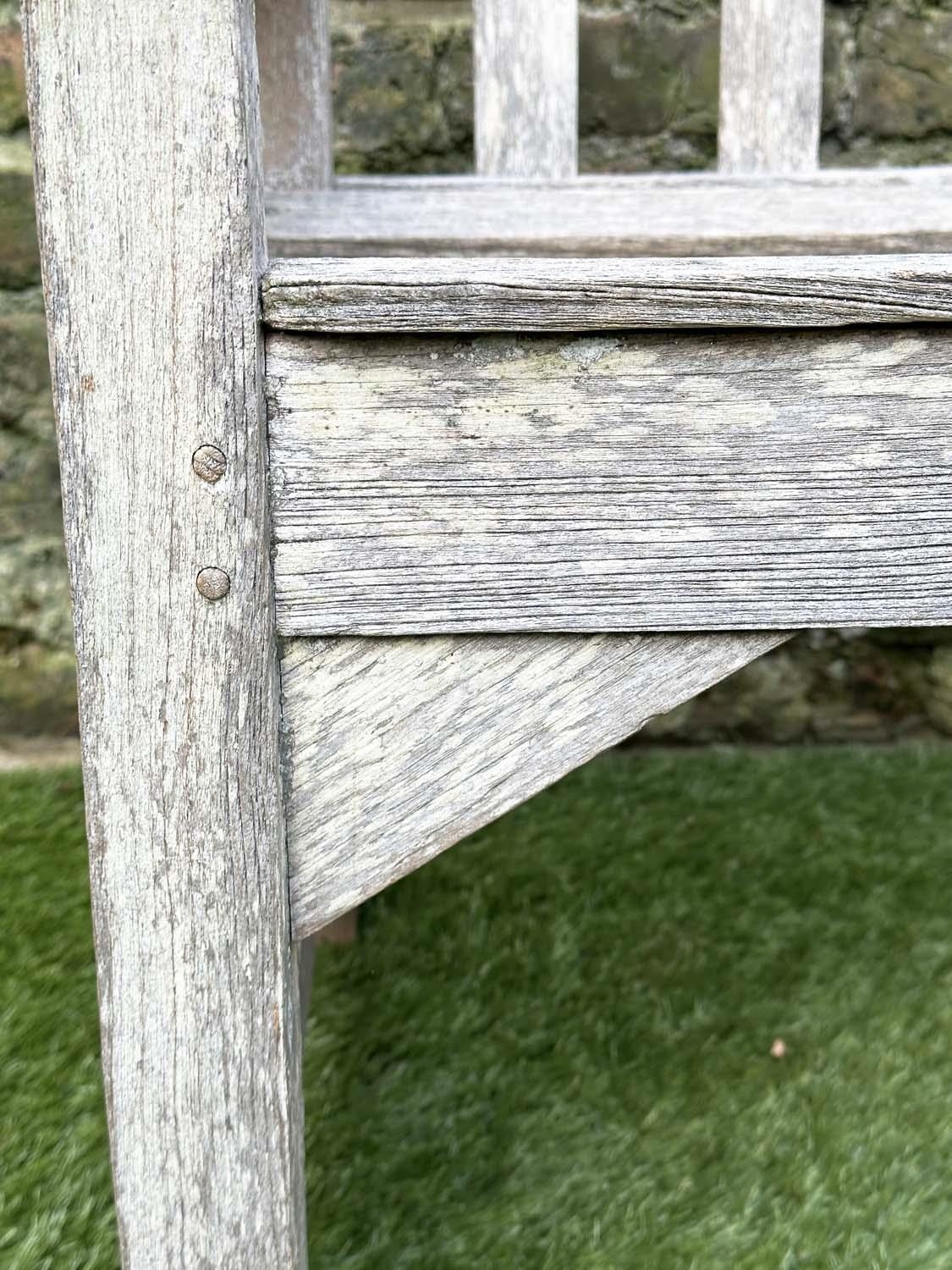 GARDEN BENCH, silvery weathered teak of slatted construction, 130cm W, by 'Lister'. - Image 2 of 8