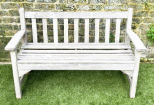 GARDEN BENCH, silvery weathered teak of slatted construction, 130cm W, by 'Lister'.