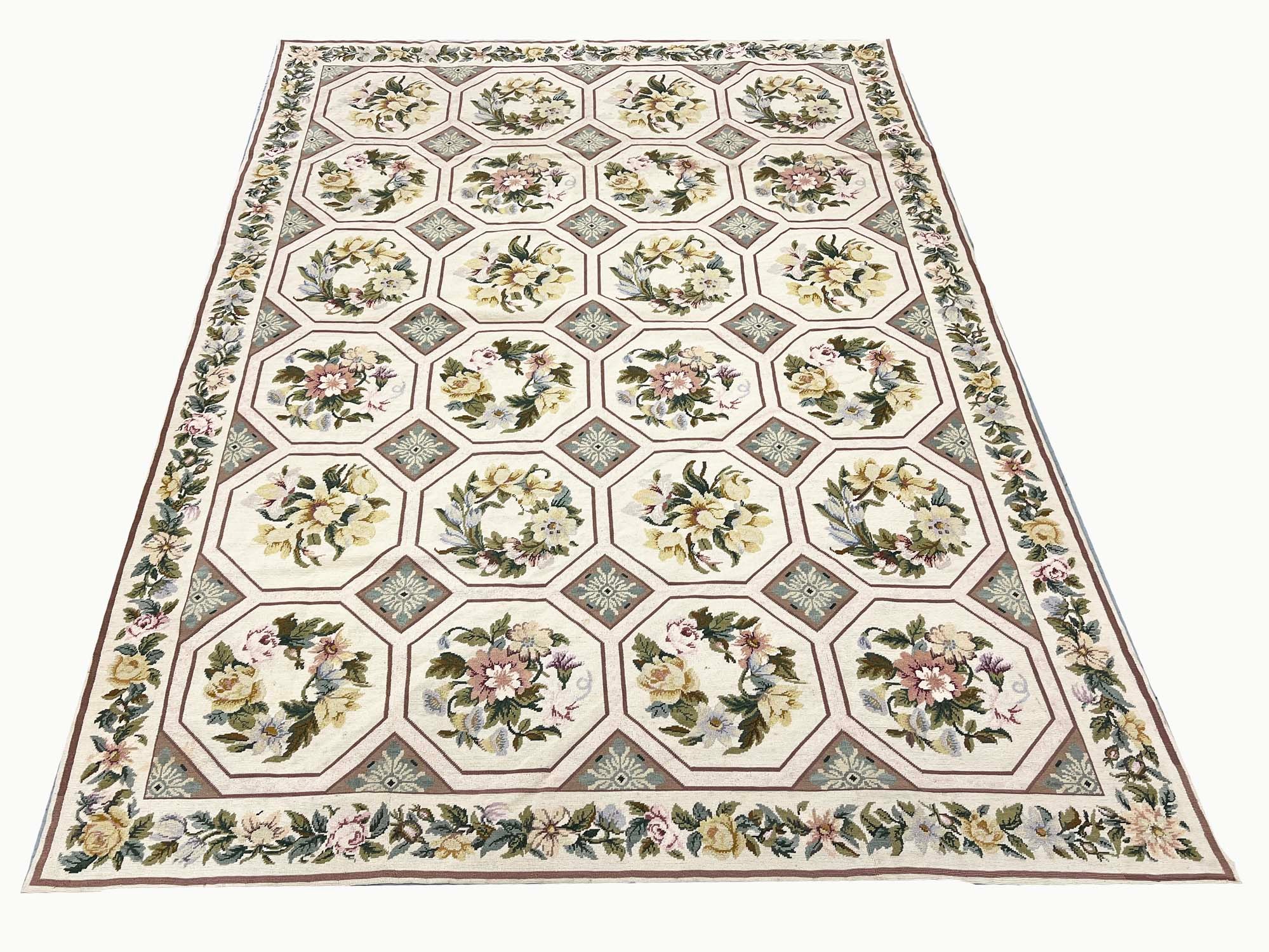 NEEDLEPOINT WOOLEN CARPET, 273cm x 193cm, Cream-coloured ground inset with floral-sprigs within