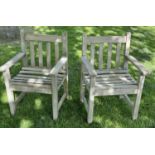 GARDEN ARMCHAIRS, a pair, silvery weathered teak and slatted with flat top arms, 86cm H x 50cm W x