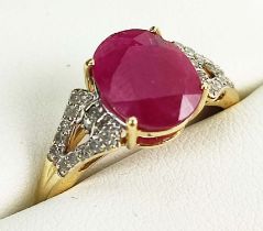 A 9CT GOLD RUBY AND DIAMOND RING, the mixed cut ruby stone claw set, diamond shoulders, ring size Q,