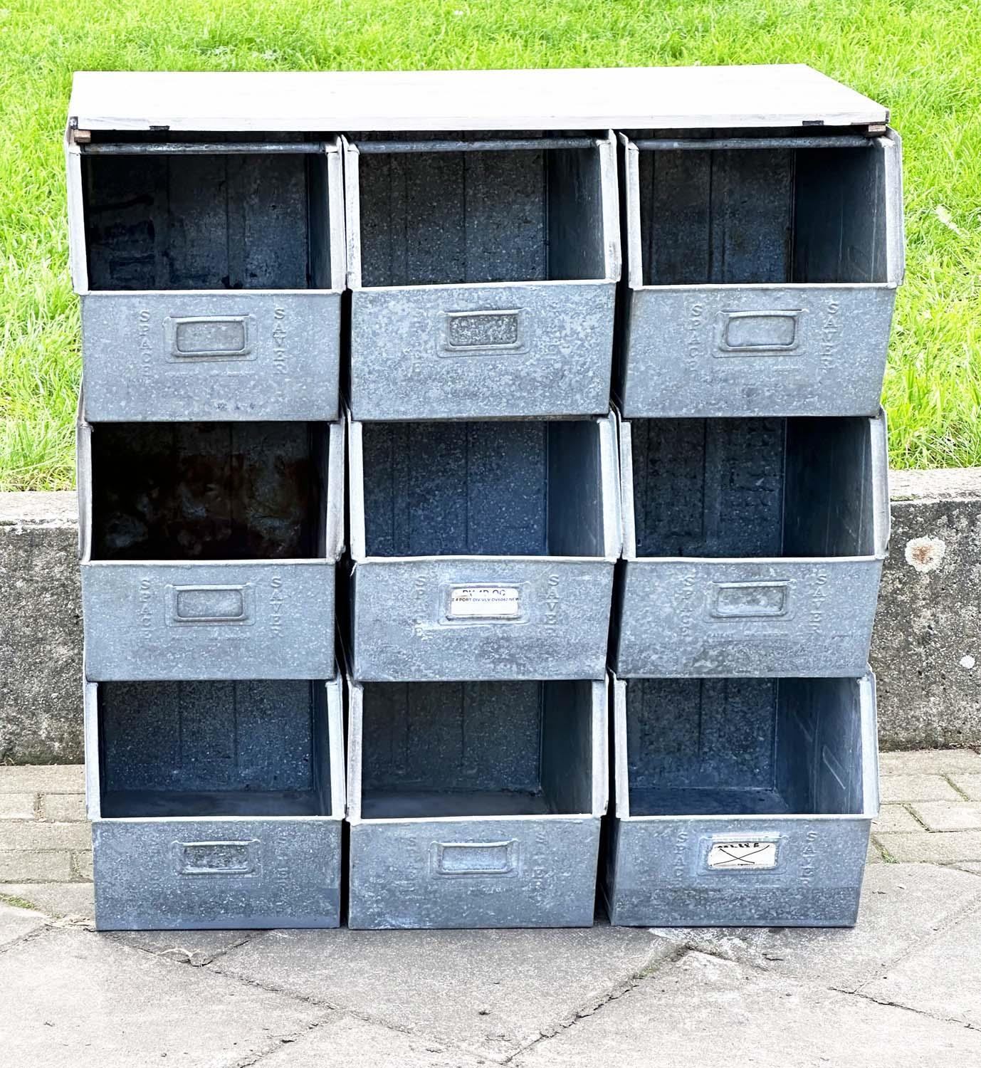 STACKING TRAYS, a set of nine, galvanised with softwood work top, 90cm x 50cm x 91cm H.