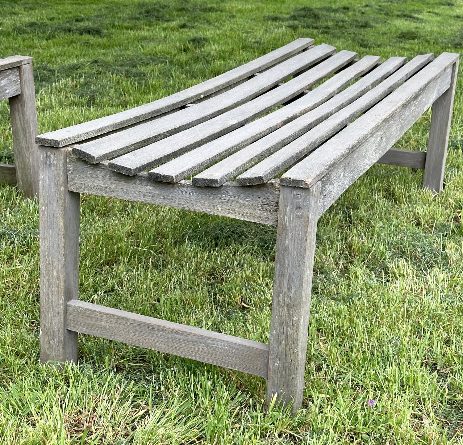 GARDEN BENCHES, a pair, well weathered teak and slatted, 140cm W x 50cm D x 44cm H. (2) - Image 4 of 6