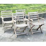 GARDEN ARMCHAIRS BY ALEXANDER ROSE, a set of four, nicely weathered teak each folding with arms,