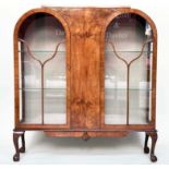 ART DECO DISPLAY CASE, burr walnut with two arched glazed doors enclosing shelves, 117cm W x 128cm H