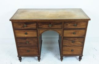 KNEEHOLE DESK, Regency mahogany, with faded tan leather top over seven drawers, 113cm W x 52cm D x