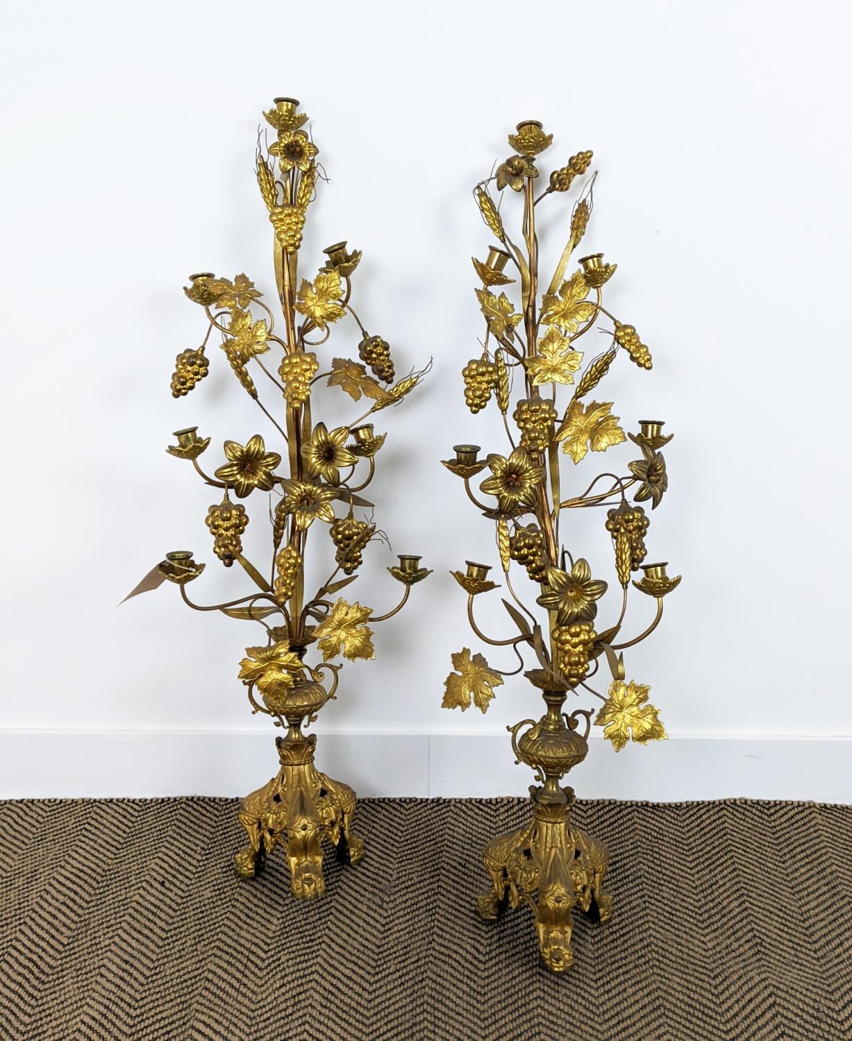 TABLE CANDLABRAS, a pair, each 107cm H x 33cm W, gilt metal with grain and grape detail, with candle