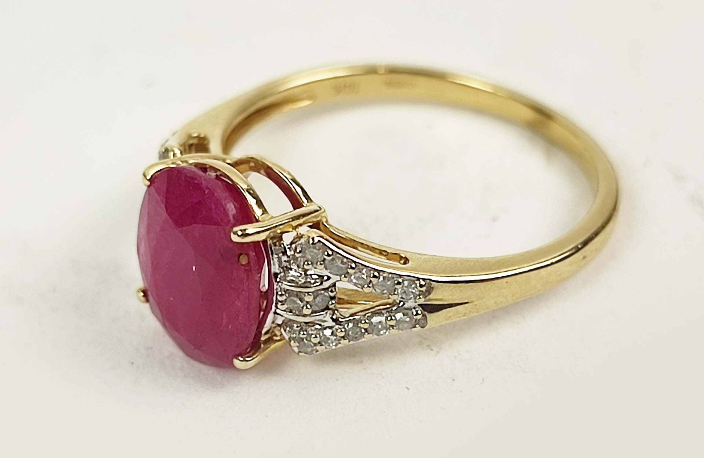 A 9CT GOLD RUBY AND DIAMOND RING, the mixed cut ruby stone claw set, diamond shoulders, ring size Q, - Image 3 of 4